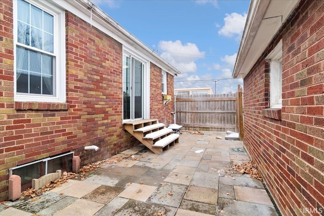 view of side of property featuring a patio area