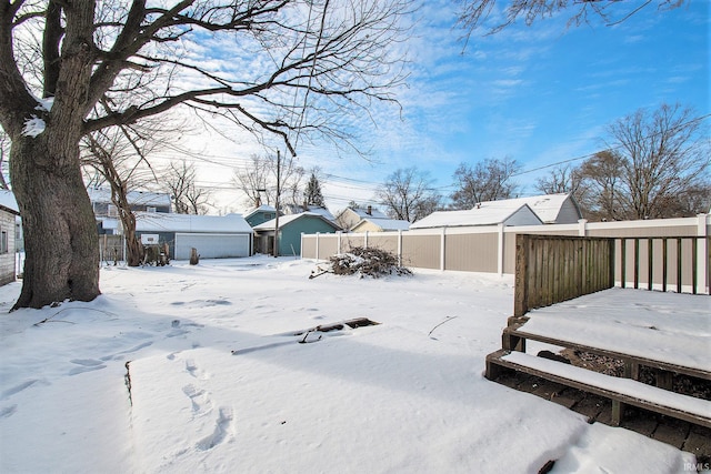 view of yard layered in snow