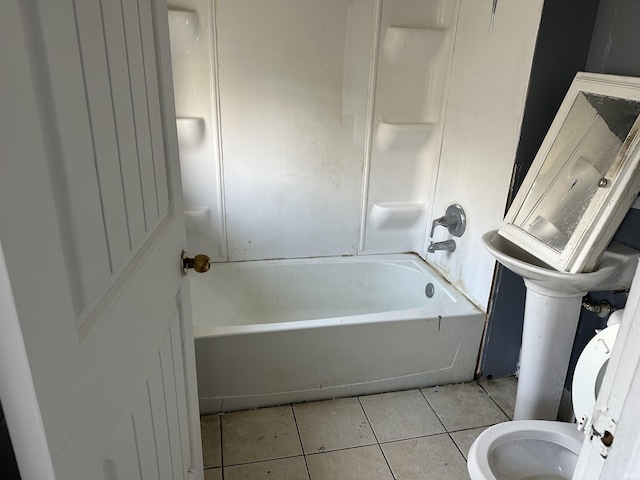 bathroom with tile patterned floors and toilet