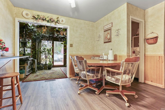 dining room featuring wood-type flooring and breakfast area