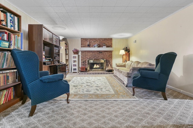 living room with carpet, a brick fireplace, and crown molding