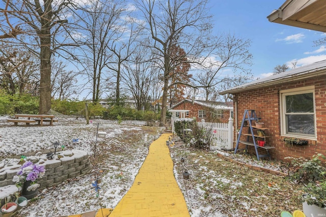 view of yard covered in snow