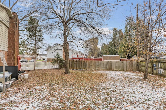 view of yard layered in snow