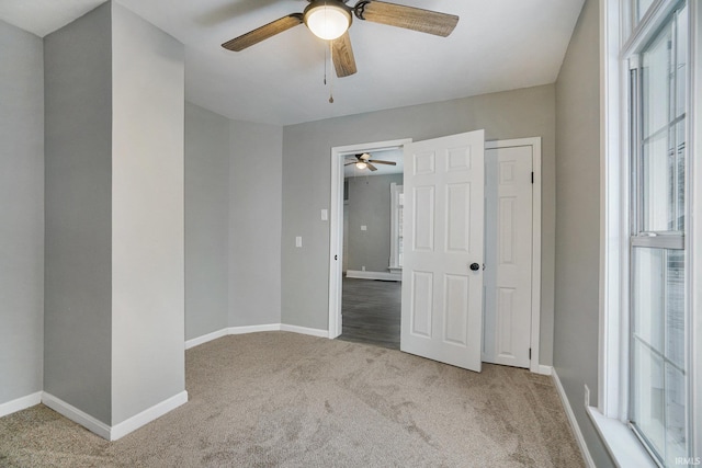 carpeted empty room featuring a healthy amount of sunlight