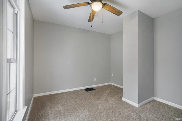 carpeted empty room with ceiling fan