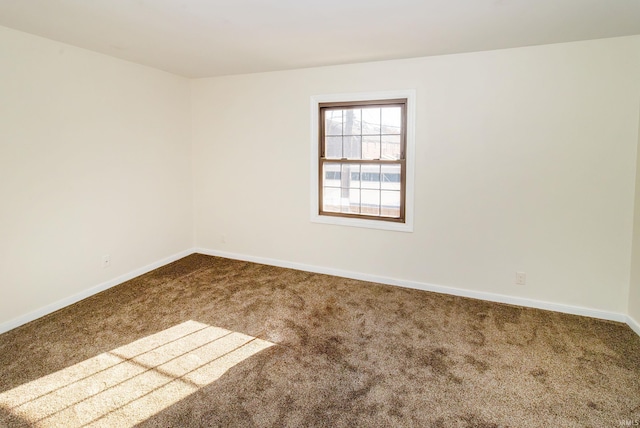 empty room featuring carpet flooring