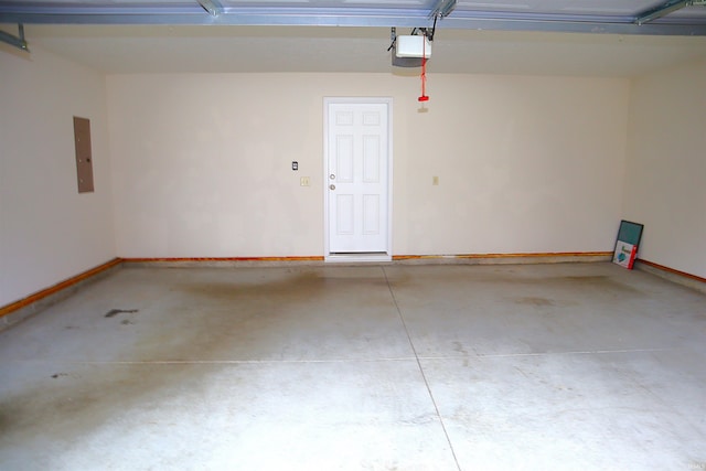 garage featuring a garage door opener and electric panel