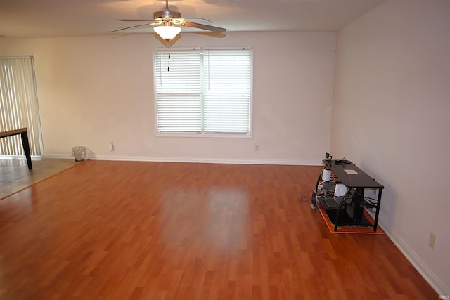 unfurnished room featuring hardwood / wood-style flooring and ceiling fan