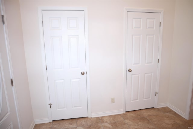 unfurnished bedroom with light tile patterned floors