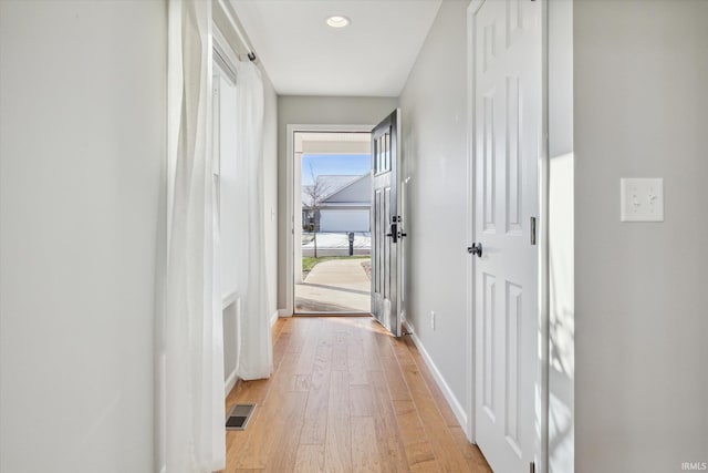 hall with light wood-type flooring