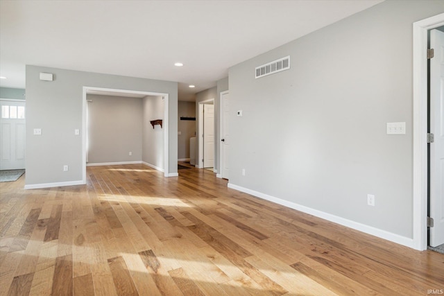 spare room with light wood-type flooring