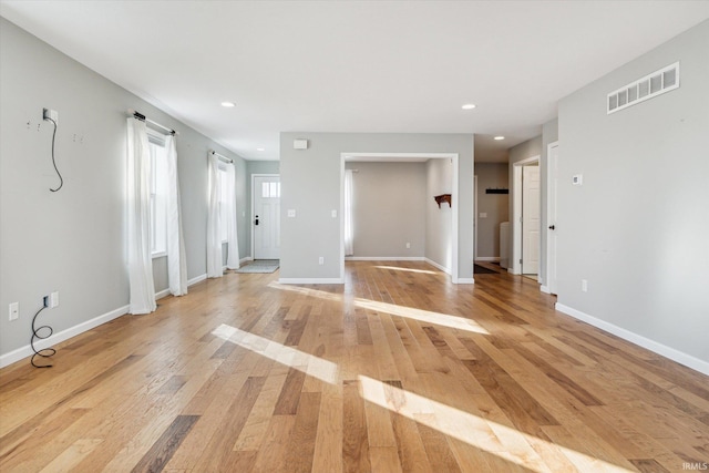 spare room featuring light hardwood / wood-style floors