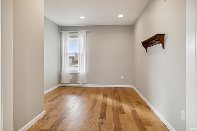 empty room with light hardwood / wood-style floors