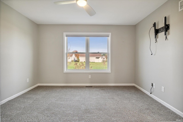 carpeted empty room with ceiling fan