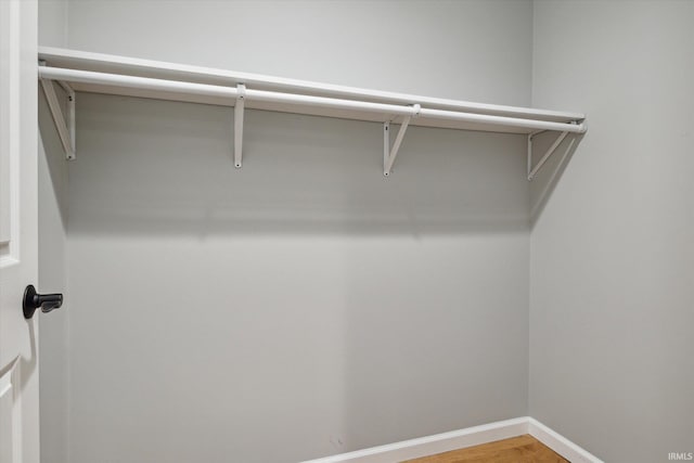 walk in closet featuring hardwood / wood-style flooring