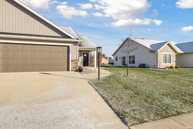 view of property exterior with a lawn, a garage, and central AC