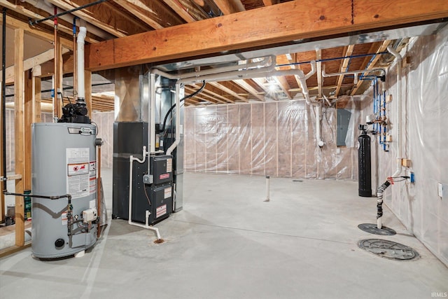 basement with electric panel, heating unit, and water heater