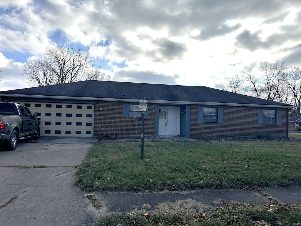 ranch-style house with a front lawn and a garage