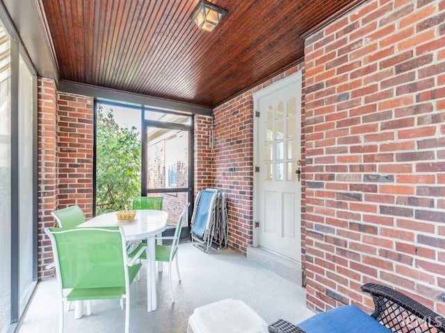 sunroom / solarium featuring wooden ceiling