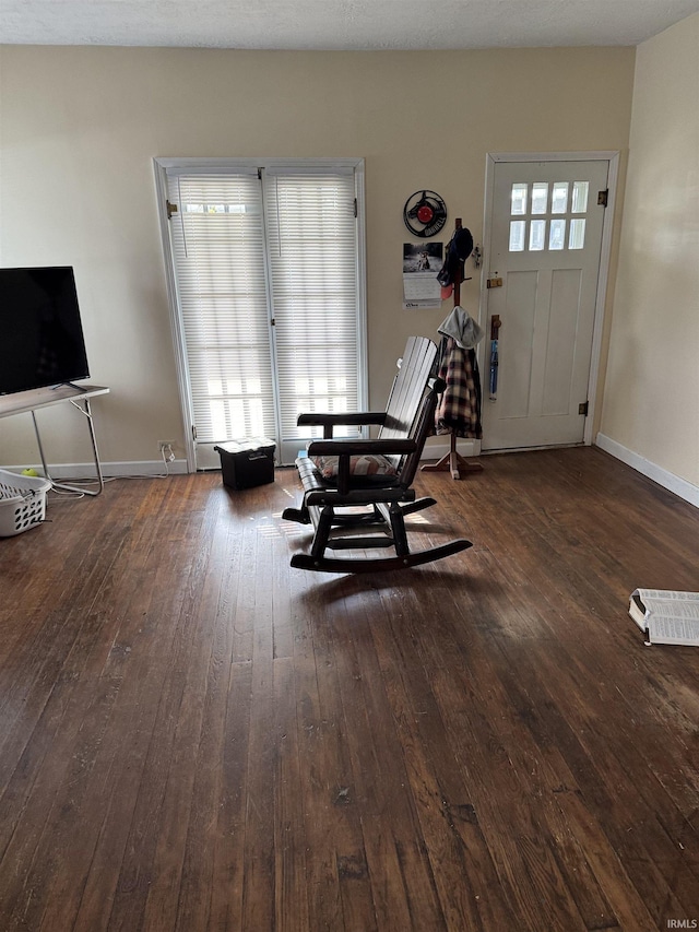 interior space featuring plenty of natural light and dark wood-type flooring