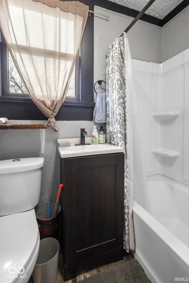 full bathroom with shower / tub combo, toilet, and sink