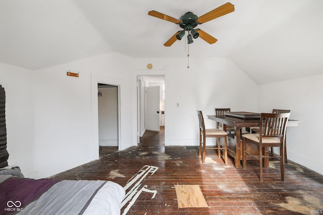 dining room featuring vaulted ceiling, ceiling fan, and dark hardwood / wood-style floors