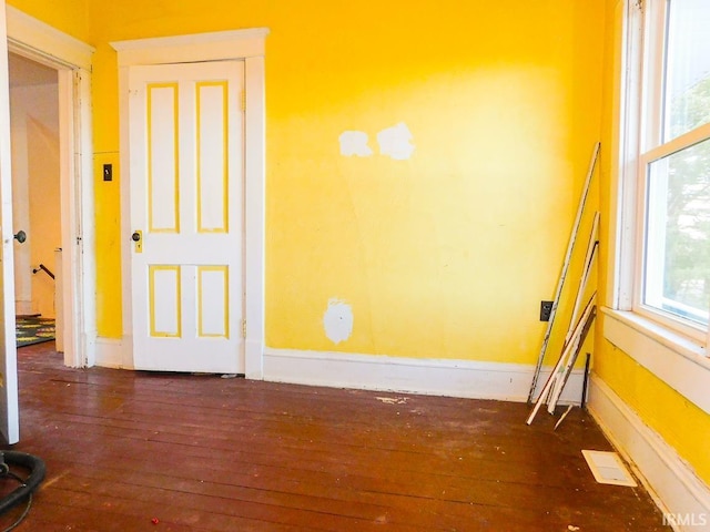 empty room featuring dark hardwood / wood-style floors