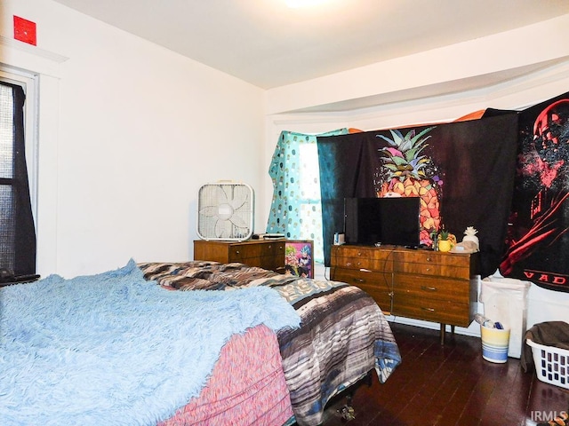 bedroom with hardwood / wood-style floors