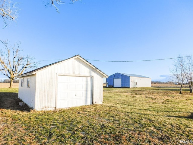 garage featuring a yard