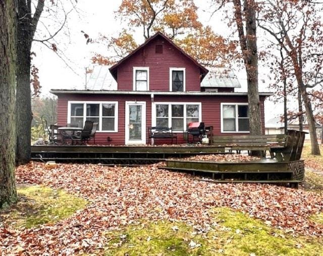 back of property with a wooden deck