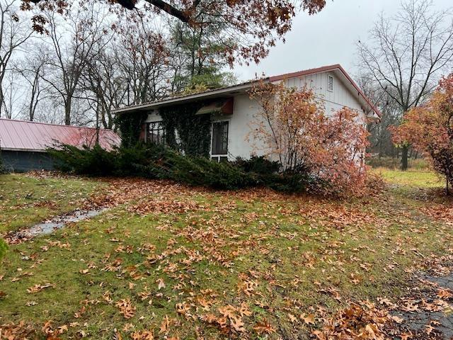 315 N Lane 130a, Lake George, Fremont, IN 46737 - view of side of home featuring a lawn