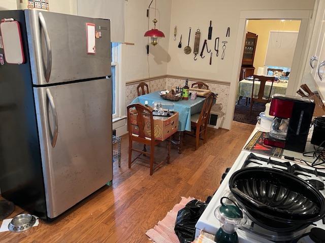 dining room with wood-type flooring