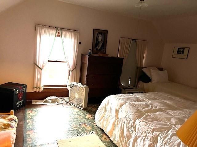 bedroom with vaulted ceiling