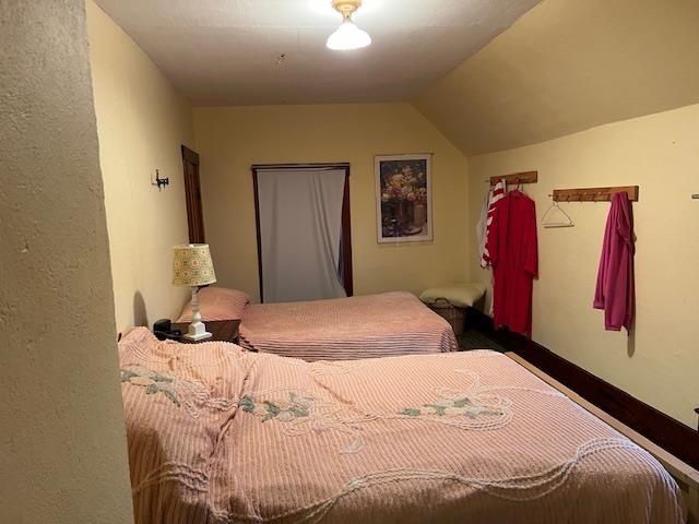 bedroom featuring lofted ceiling