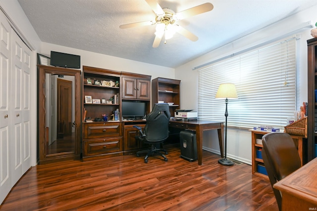 office with ceiling fan, dark wood-type flooring, and a textured ceiling