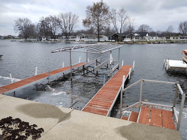 dock area with a water view