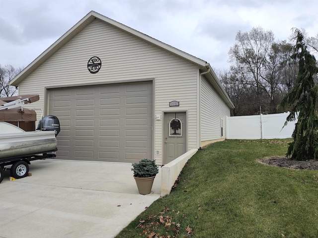 garage featuring a lawn