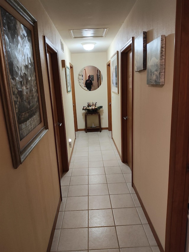 hallway featuring light tile patterned floors