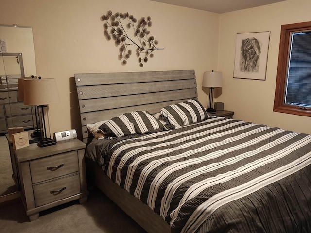 bedroom featuring dark colored carpet