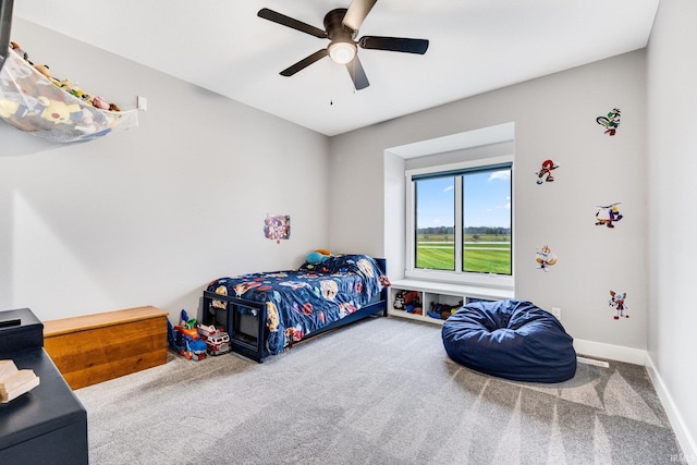 bedroom featuring ceiling fan and carpet floors