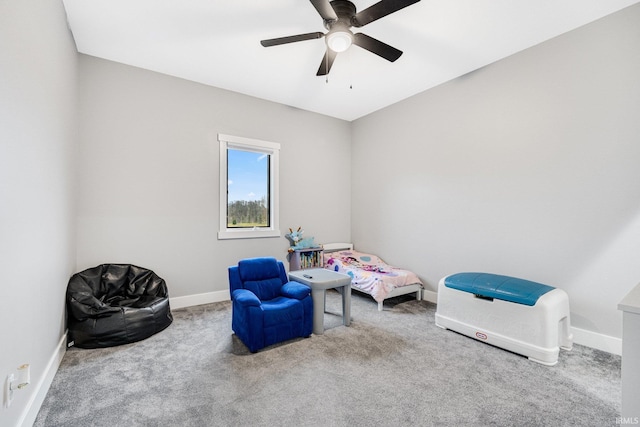 living area with ceiling fan and carpet floors