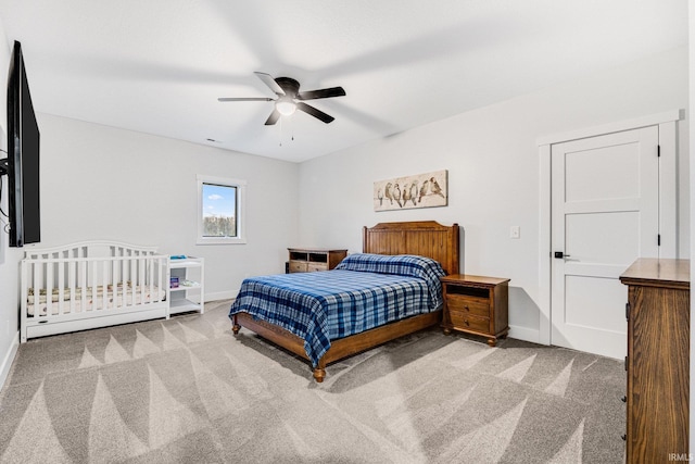 carpeted bedroom featuring ceiling fan