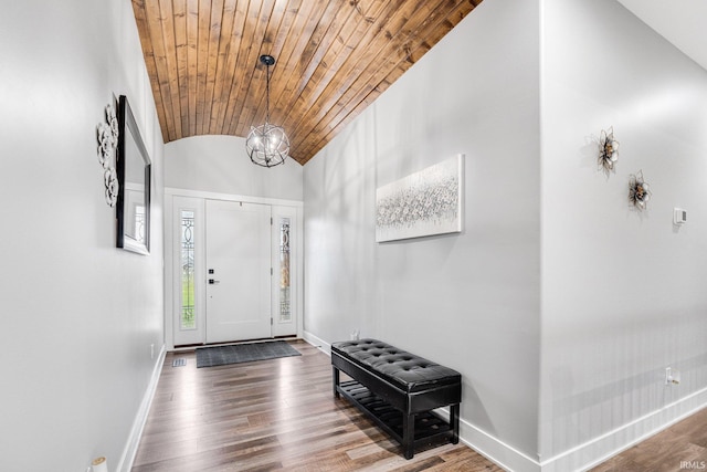 foyer entrance featuring a chandelier, hardwood / wood-style floors, vaulted ceiling, and wood ceiling