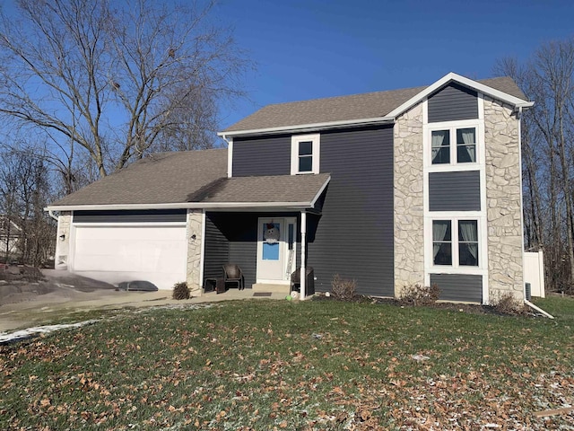 front facade with a garage and a front lawn