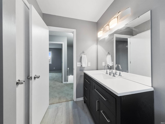 bathroom featuring hardwood / wood-style floors and vanity