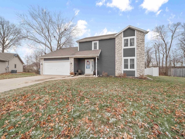 view of front of home featuring a front lawn, central AC unit, and a garage