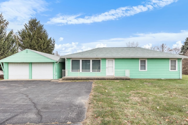 single story home featuring a garage and a front yard