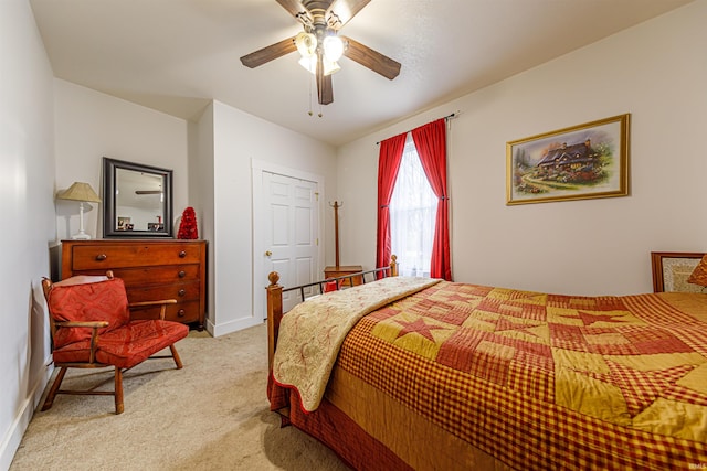 bedroom with ceiling fan and light colored carpet