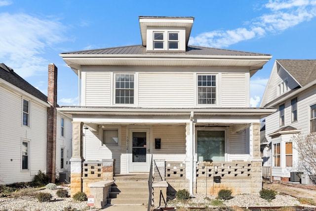 front of property featuring covered porch and central AC unit