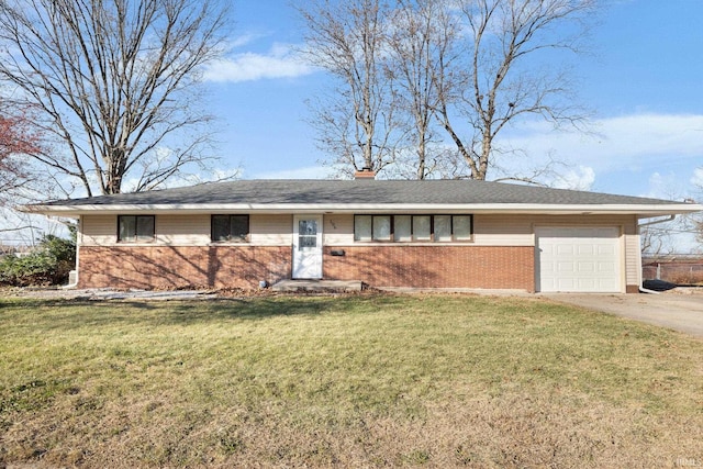 ranch-style house with a front yard and a garage